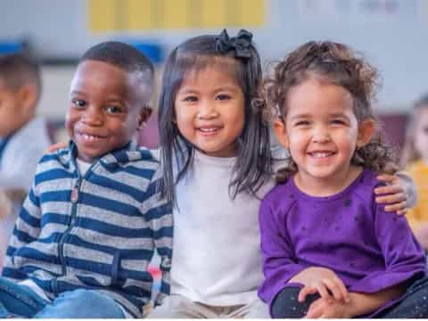 a group of children smiling