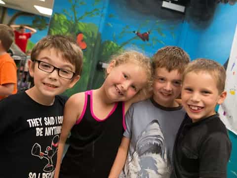 a group of kids posing for a photo