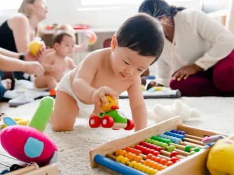 a baby playing with toys