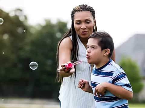 a person holding a child