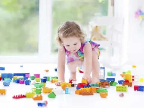 a baby playing with toys