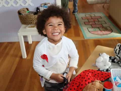 a child smiling at the camera