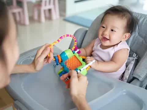 a baby playing with a toy