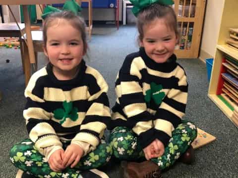 two children sitting on the floor