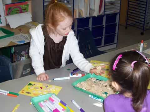 a few young girls painting