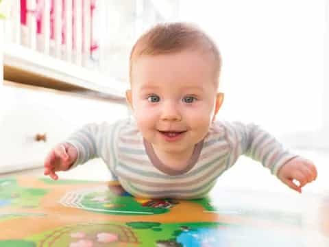 a baby crawling on a table