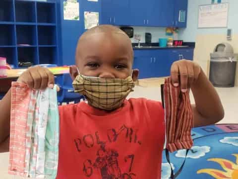 a baby sitting at a table