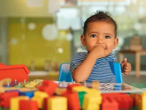 a child sitting at a table