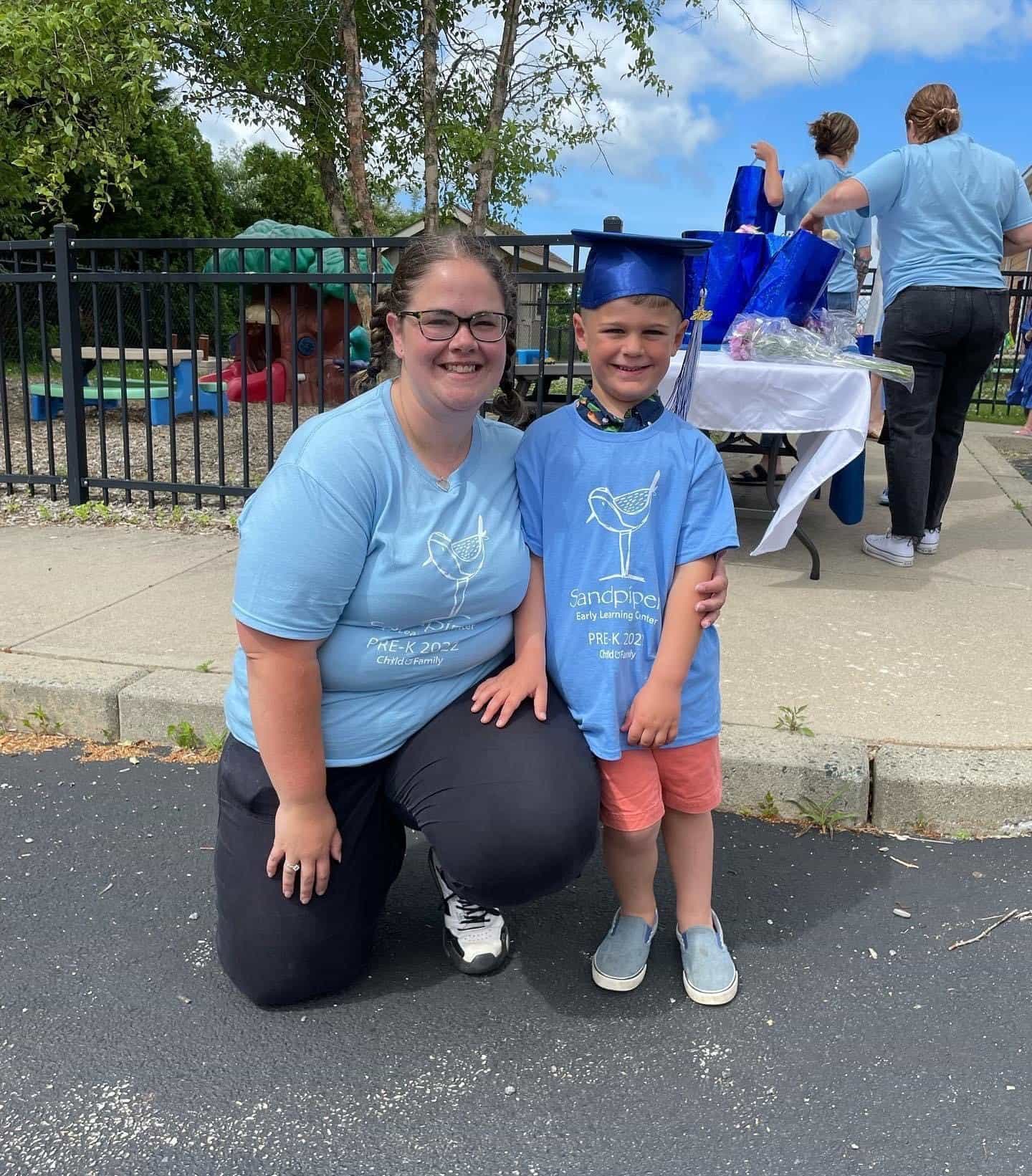 a person and a boy posing for a picture