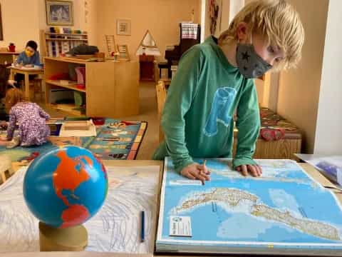 a child painting on a table