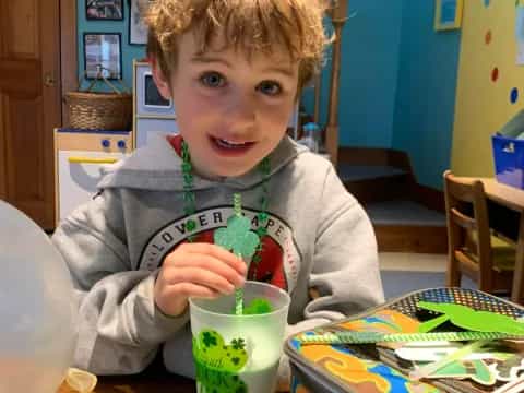a boy sitting at a table