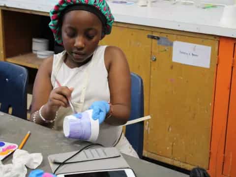 a person painting on a table