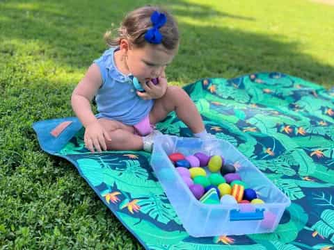 a girl playing with a ball