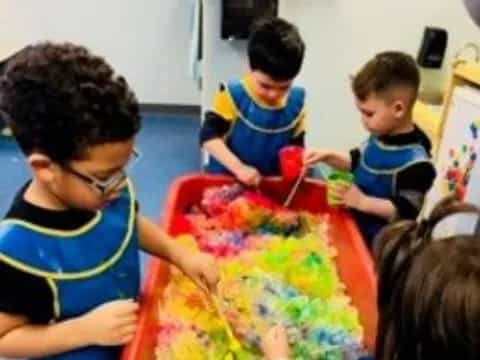 a group of children painting