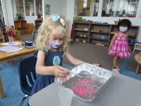 a young girl wearing a mask