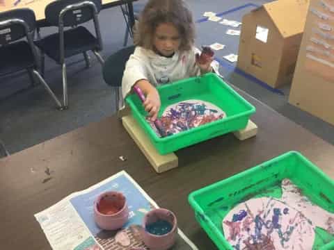 a child sitting at a table