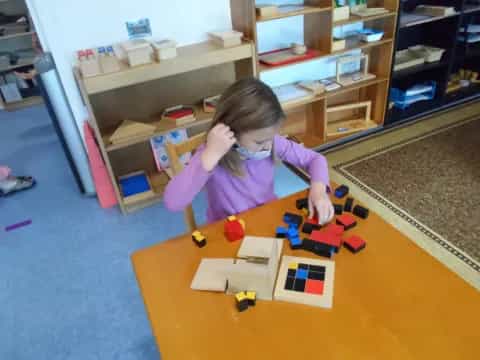 a girl playing with toys