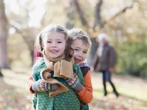 a couple of children hugging