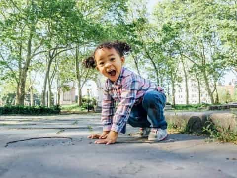 a girl sitting on the ground