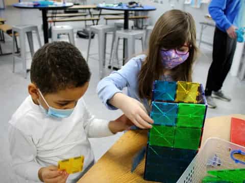 a boy and girl painting