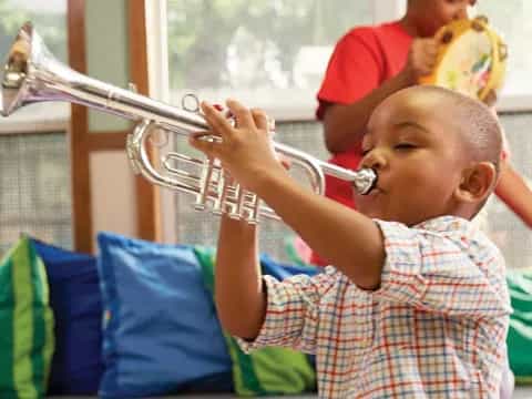 a boy playing a violin