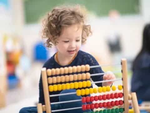 a child playing with a toy