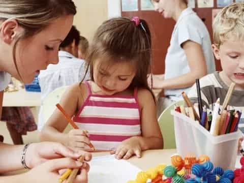 a group of children painting