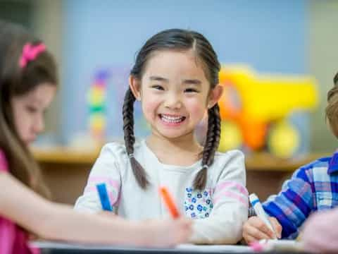 a young girl smiling