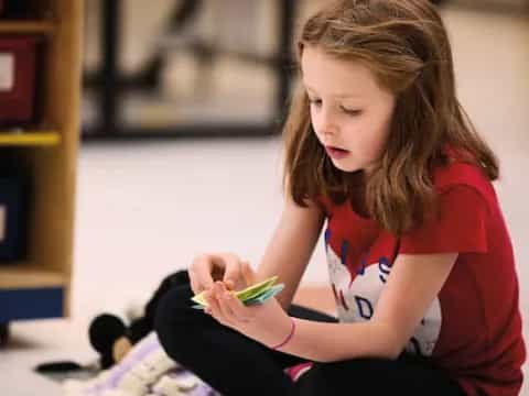 a girl sitting on the floor