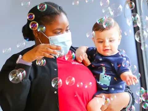 a person holding a baby