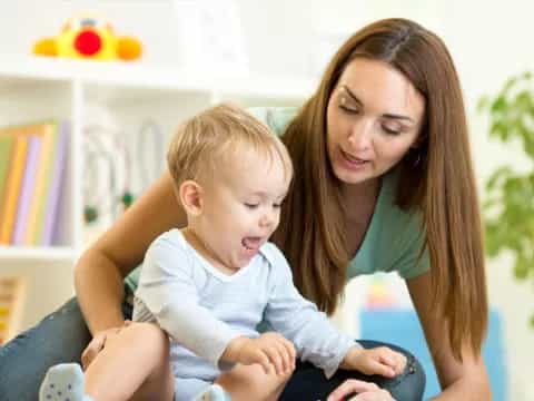 a person holding a baby