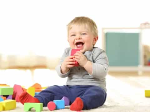 a baby playing with a toy