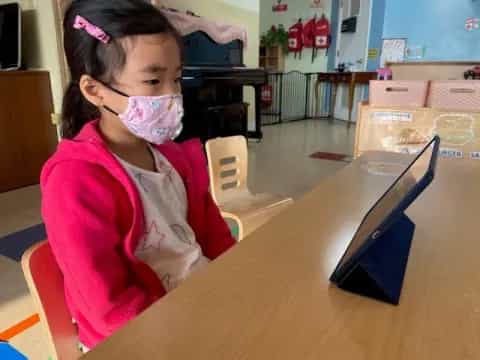 a young girl with a face mask