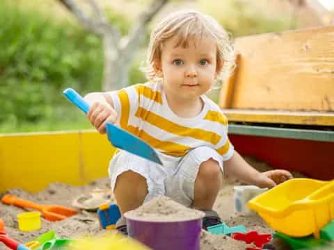 a baby playing with toys