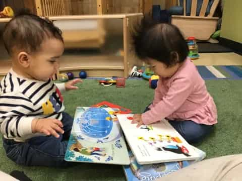 a couple of children playing with toys