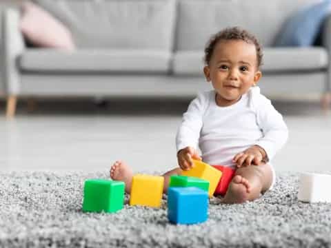 a baby playing with toys