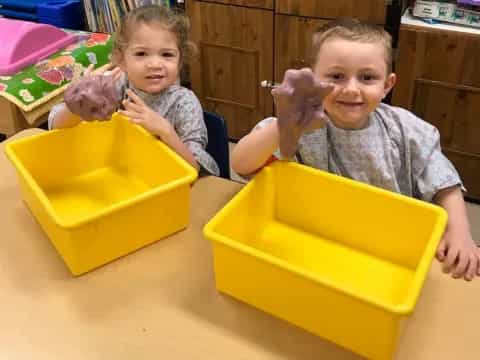 a couple of kids playing with toys