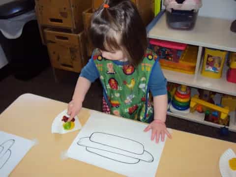 a child drawing on a paper