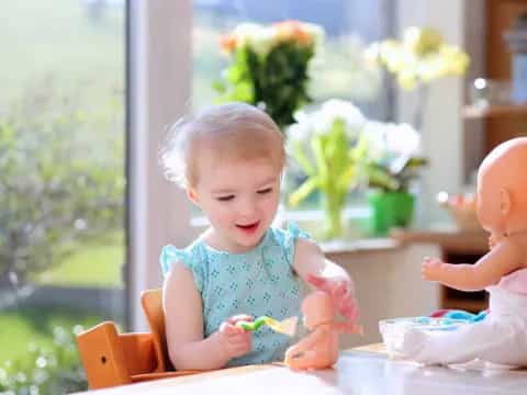 a baby sitting at a table