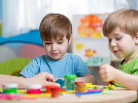 a couple of boys playing with toys