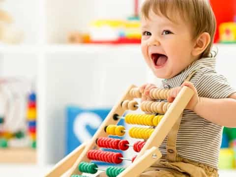 a baby playing with toys