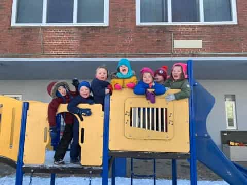 a group of kids on a playground