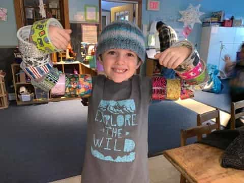 a boy holding a bowling ball