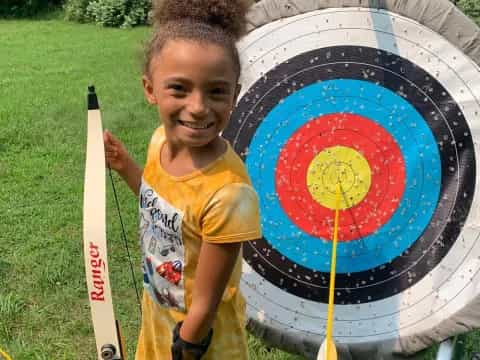 a boy holding a target