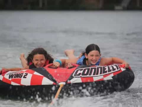 a couple of kids on a raft