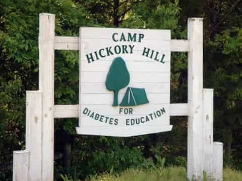 a sign on a wooden fence