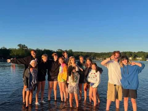 a group of people standing in water