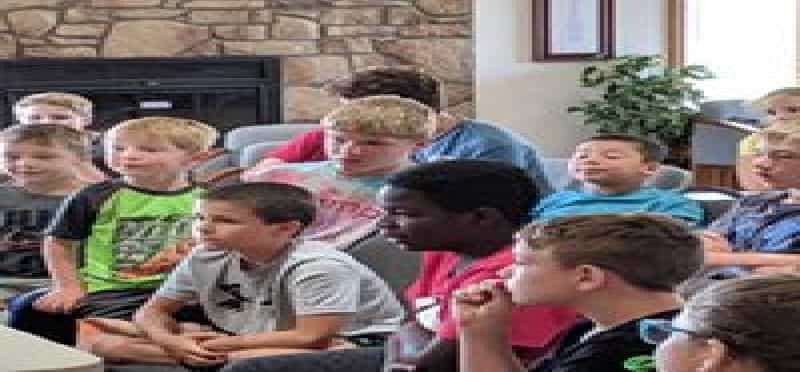 a group of children in a classroom