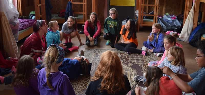 a group of children sitting on the floor