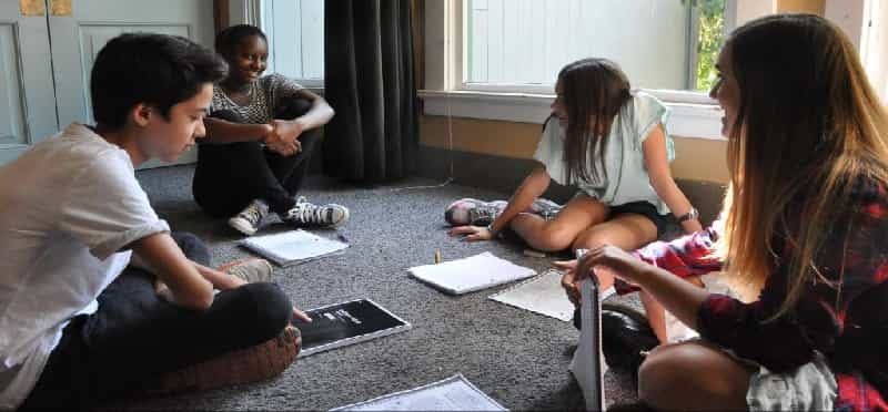 a group of people sitting on the floor